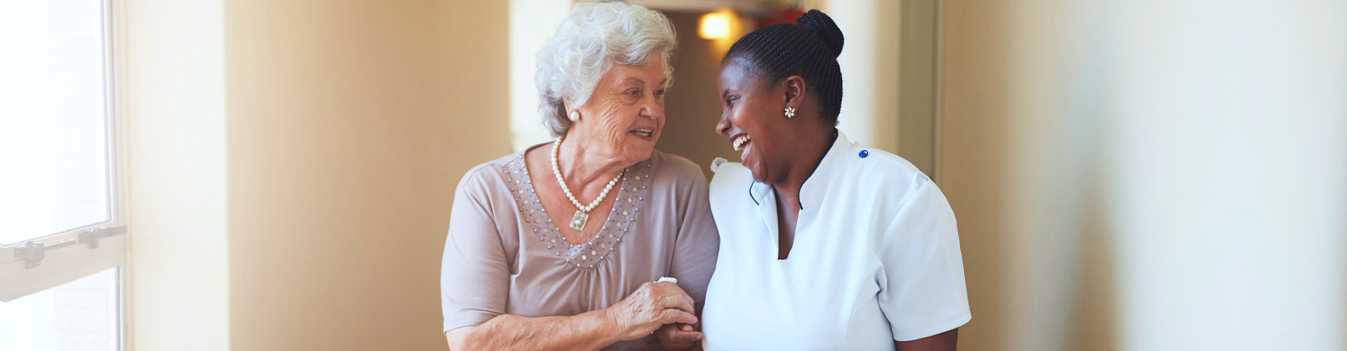 caregiver looking to each other while smiling