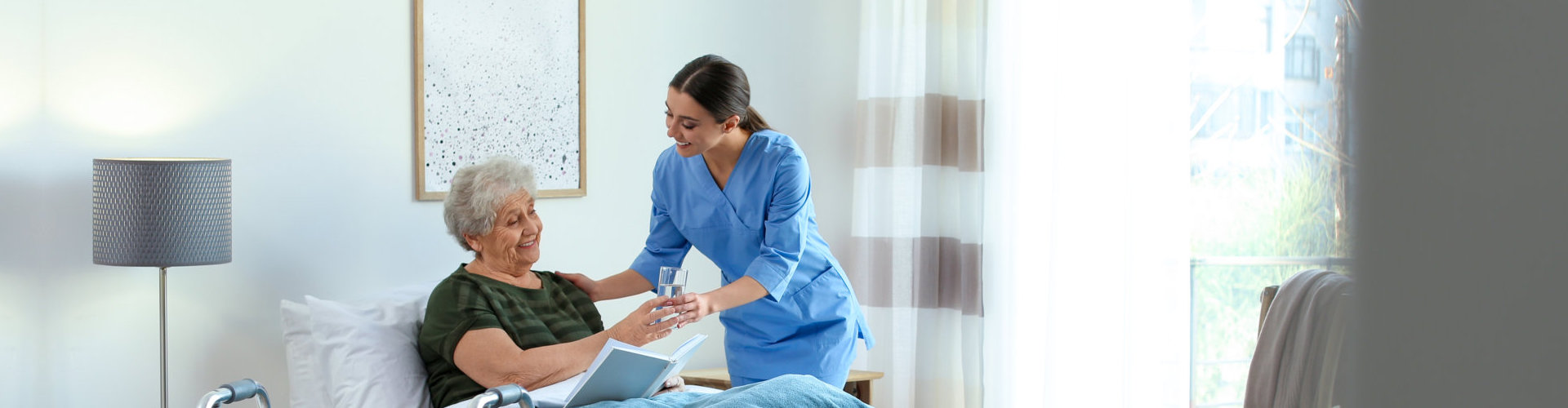 caregiver serving a glass of water